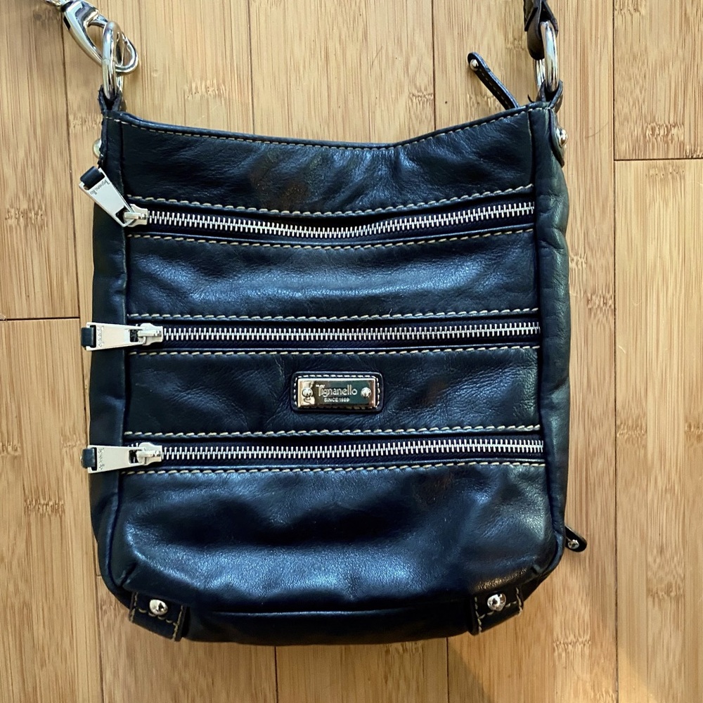 Tignanello black leather purse with silly flowered lining.